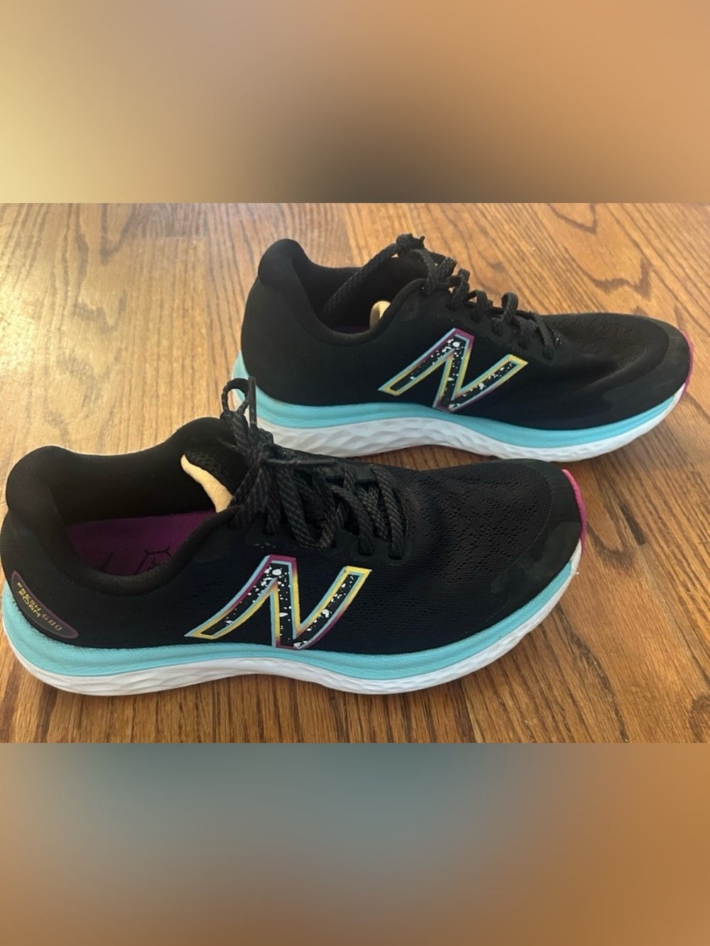 New Balance Women's Black Running Shoes with Teal and Pink Accents